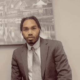 Terrence Ward Jr. in a professional suit portrait